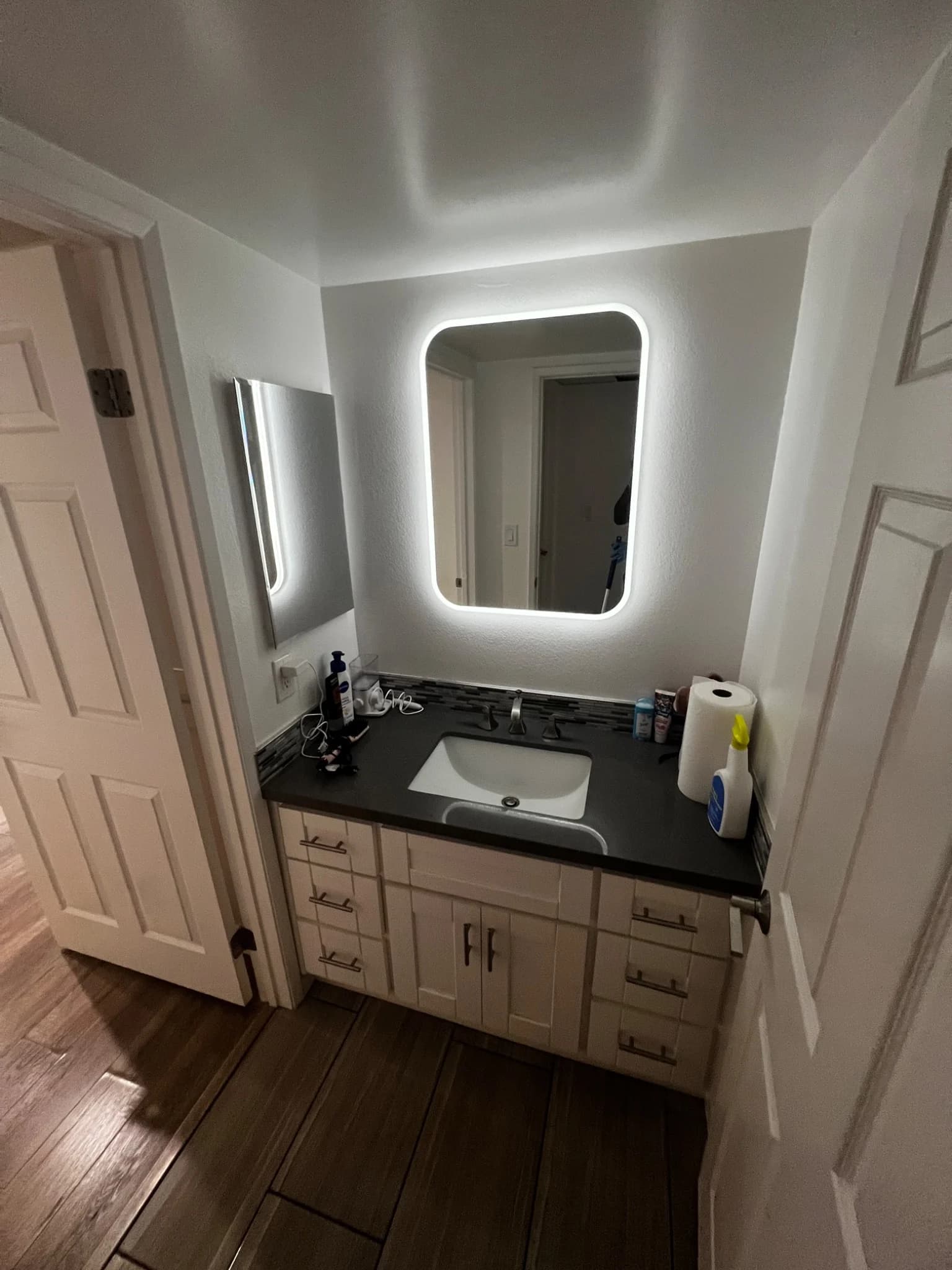 Clean residential bathroom vanity completed by StudioScrubz